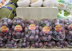 Fresh plums melons, branded by Xianfeng Fruit Company.